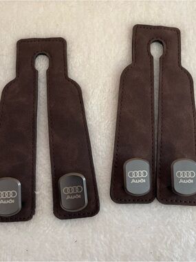 Pair of Audi faux leather hooks for car